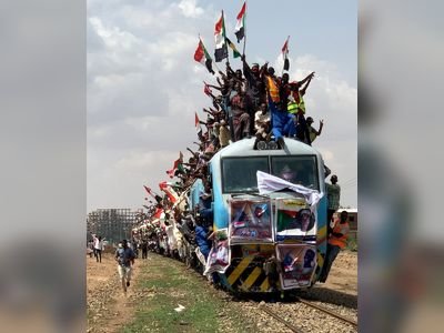 Sudanese civilians join in the celebrations of the signing of Sudan's power-sharing deal that ushers in a new governing council, including both civilians and generals, to pave the way towards elections and civilian rule.