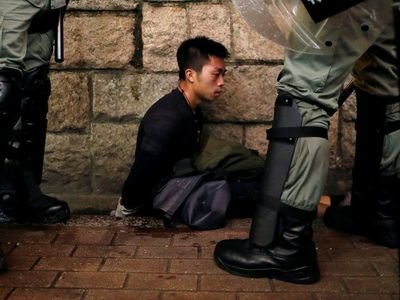 Riot police officers detain an anti-extradition bill protester during a demonstration in Tsim Sha Tsui neighbourhood in Hong Kong. Since June, Hong Kong has been rocked by protests after the government introduced plans for changes to legislation that would allow for criminal suspects to potentially be extradited to China.