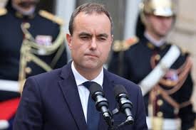 French Prime Minister Faces Budget Struggles Amid Downgrade