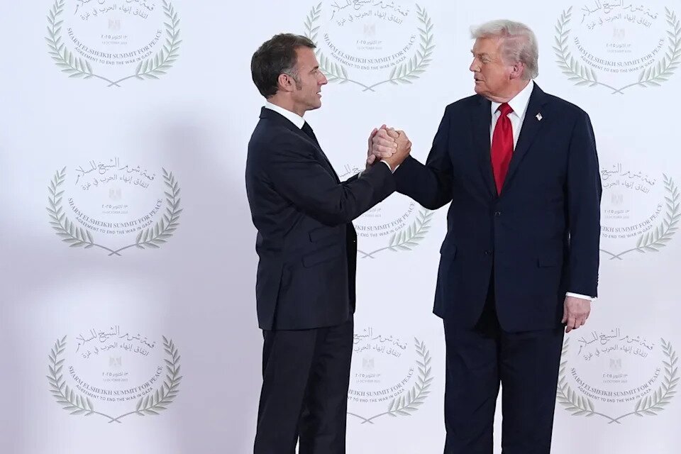 Trump’s Signature Handshake Returns in Meeting with Macron