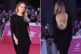 Angelina Jolie Stuns at Italian Film Premiere With Striking Back Tattoos