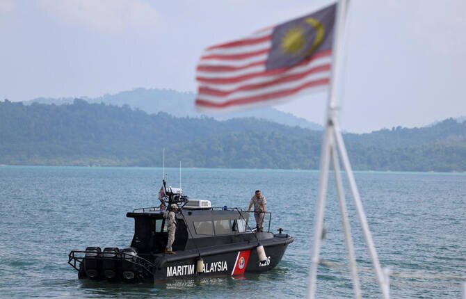 Malaysian and Thai Authorities Recover at Least 21 Bodies from Migrant Shipwreck