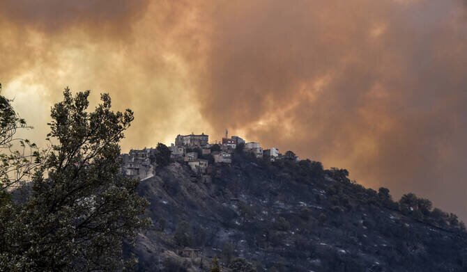 Algerian Firefighters Battle Wildfire Near Algiers After Families Evacuated