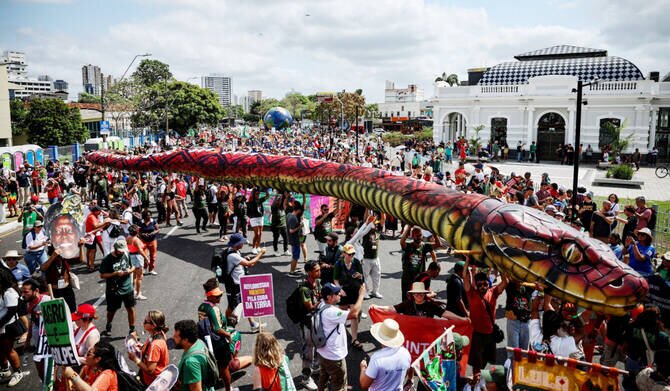Climate Protesters Demand Action at COP30 with Colorful Costumes and Drums