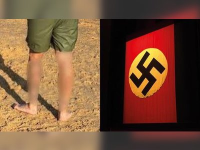 Australian Man Charged After Displaying Nazi Tattoos at Newcastle Beach