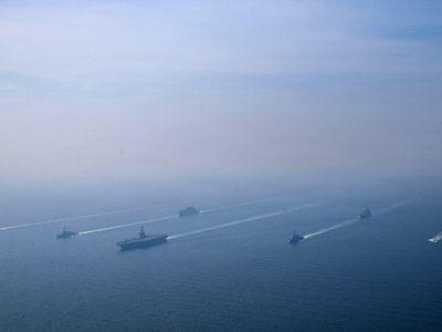 White House Urges Iran to Accept Deal as U.S. Reinforces Military Posture in Region