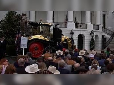 Trump Draws Attention at Event After Admiring Striking Gold Tractor Display
